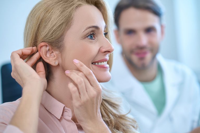 Woman getting hearing aid